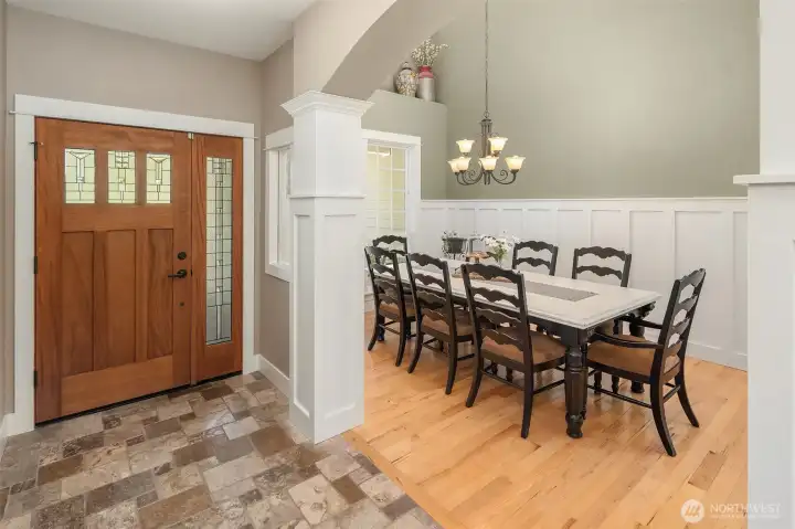 Beside the entry, the formal dining room makes an immediate statement. Custom hand-textured walls rise above a perfectly smooth surface beneath the architectural wainscoting, revealing the kind of craftsmanship and attention to detail that sets this home far above the rest. Beside the entry, the formal dining room makes an immediate statement. Custom hand-textured walls rise above a perfectly smooth surface beneath the architectural wainscoting, revealing the kind of craftsmanship and attention to detail that sets this home far above the rest.
