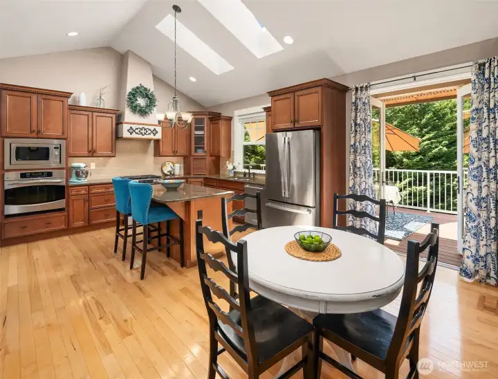 It’s easy to let your eye wander straight to the kitchen, but first take in the abundance of natural light pouring through the skylights overhead and the 8-foot Andersen outswing French doors, beckoning you toward the completely private upper deck. It’s easy to let your eye wander straight to the kitchen, but first take in the abundance of natural light pouring through the skylights overhead and the 8-foot Andersen outswing French doors, beckoning you toward the completely private upper deck.