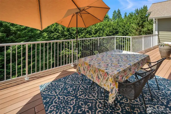 The 37-foot-long deck extends the full length of the living room, creating a completely private, generous outdoor extension with room for multiple seating areas and plenty of space to truly spread out. The 37-foot-long deck extends the full length of the living room, creating a completely private, generous outdoor extension with room for multiple seating areas and plenty of space to truly spread out.