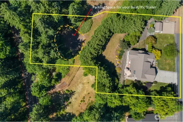 Here, you can see just how far the lot extends beyond the row of cypress trees planted through the middle of the property. Tucked behind them is a private RV and boat parking area, one of only a few authorized RV/boat parking areas in the neighborhood. Here, you can see just how far the lot extends beyond the row of cypress trees planted through the middle of the property. Tucked behind them is a private RV and boat parking area, one of only a few authorized RV/boat parking areas in the neighborhood.