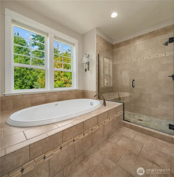 The Jacuzzi-brand jetted tub has been used only a handful of times, while the oversized step-in shower adds the easy, everyday convenience you’ve been hoping to find in your primary suite. The Jacuzzi-brand jetted tub has been used only a handful of times, while the oversized step-in shower adds the easy, everyday convenience you’ve been hoping to find in your primary suite.