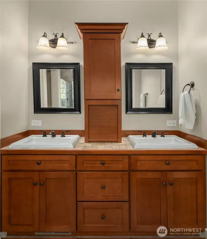 The dual vanity gives each person their own space, making busy mornings smoother and everyday routines a little easier. The dual vanity gives each person their own space, making busy mornings smoother and everyday routines a little easier.
