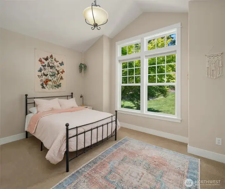 The second bedroom is also conveniently located on the main level, with 14-foot vaulted ceilings and oversized windows that fill the room with natural light. The second bedroom is also conveniently located on the main level, with 14-foot vaulted ceilings and oversized windows that fill the room with natural light.