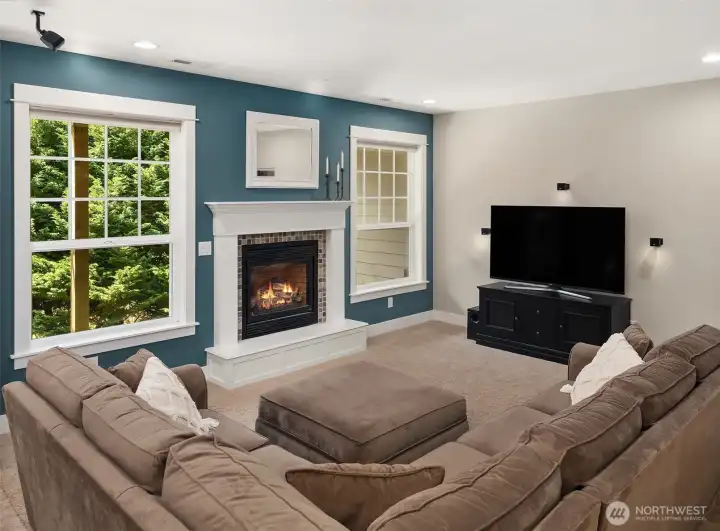 Downstairs, a second premium Napoleon fireplace becomes a stunning focal point while delivering beautiful warmth to the entire living space. Downstairs, a second premium Napoleon fireplace becomes a stunning focal point while delivering beautiful warmth to the entire living space.