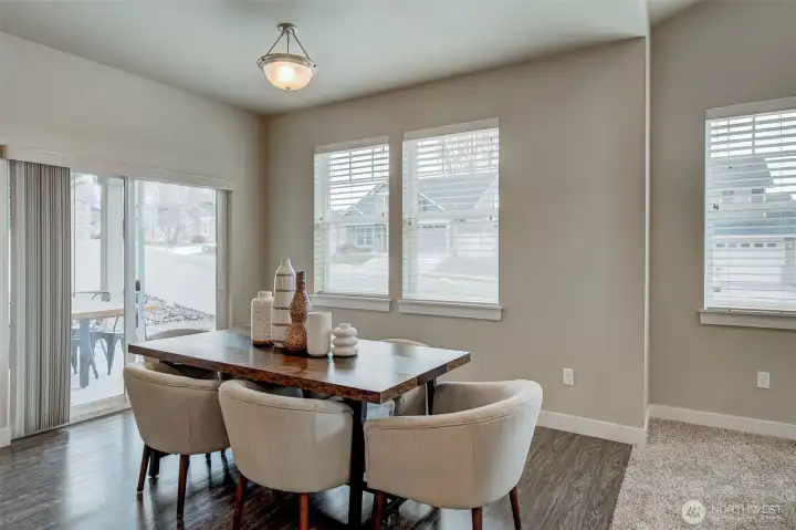 Open kitchen with a peninsula eating bar, bar seating, and seamless flow into the dining area—perfect for entertaining family and friends.