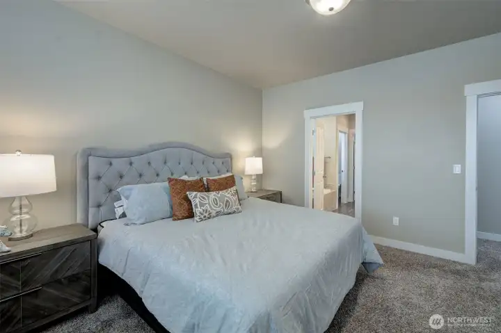 Peaceful primary retreat with generous natural light and ample space to unwind.
