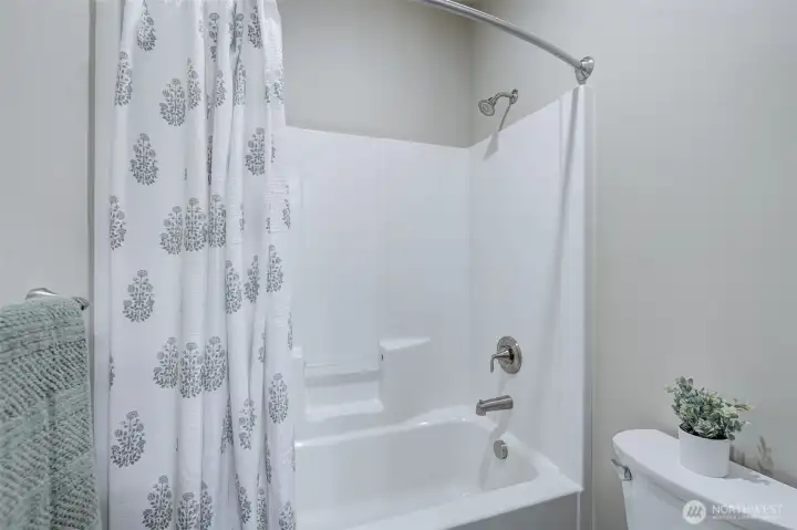 Convenient full bathroom serving the secondary bedrooms and guests.