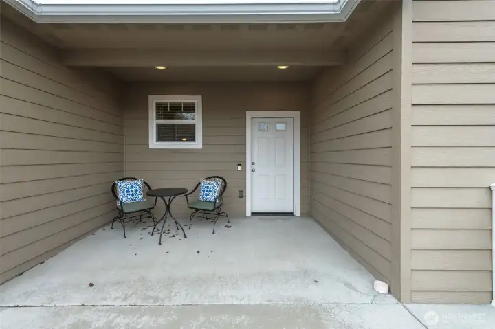 Covered front porch offering the perfect place to unwind while enjoying stunning Saddle Rock views.