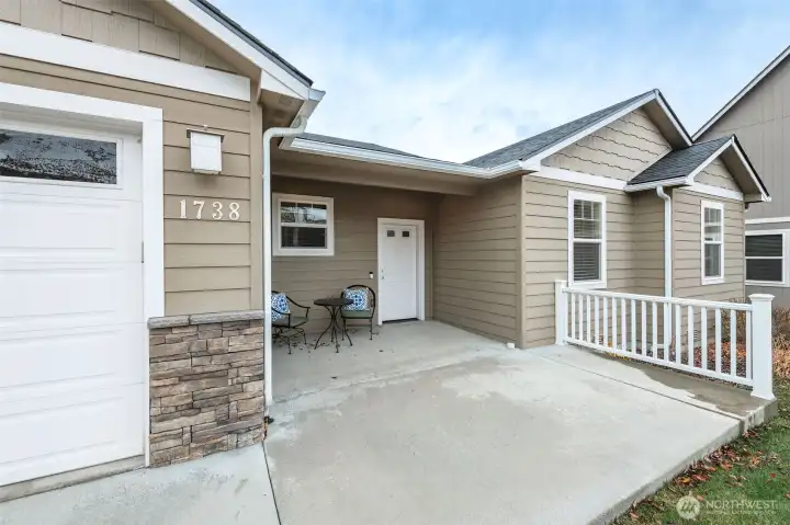 Covered front porch offering the perfect place to unwind while enjoying stunning Saddle Rock views.