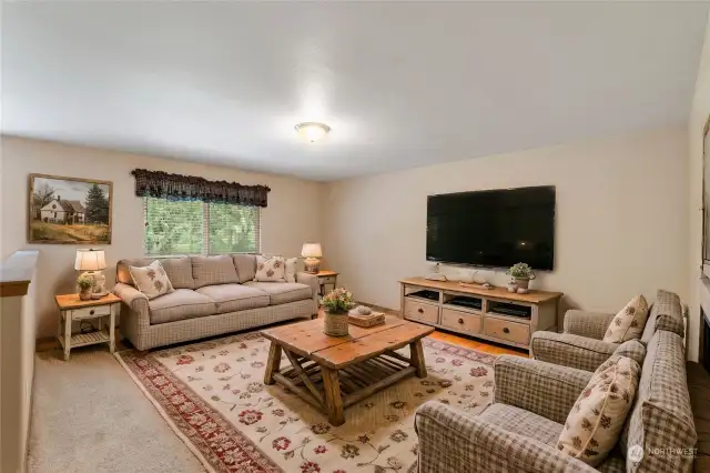 Enjoy movie night in this bonus room virtually staged