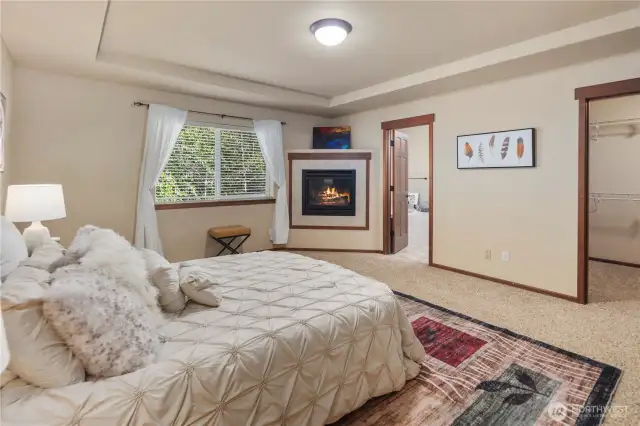 Thoughtfully designed luxurious primary suite features a custom 5-piece bath complete with a spa-like soaking tub, dual vanities, a walk-in shower, and a custom-tailored bidet.
