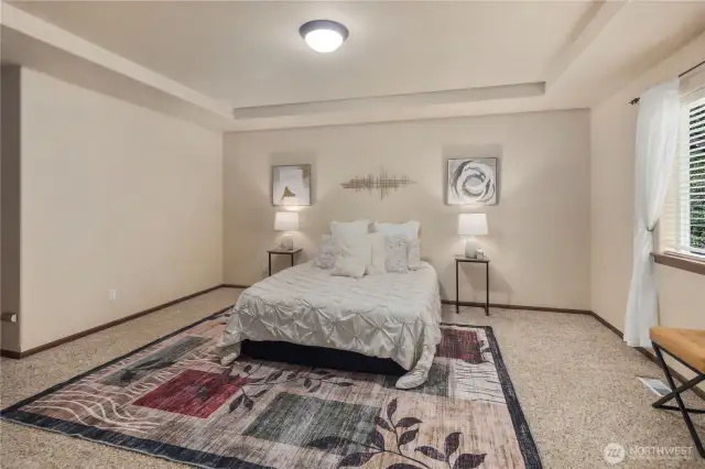 Thoughtfully designed luxurious primary suite features a custom 5-piece bath complete with a spa-like soaking tub, dual vanities, a walk-in shower, and a custom-tailored bidet.