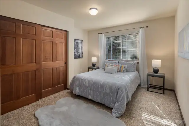 Bedroom 3 faces west, inviting in warm afternoon light.