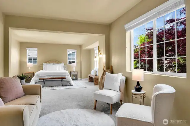 Enter the stunning primary suite, complete with an elegant sitting area.