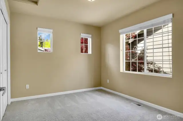 Secondary bedroom adjacent to the guest bath.