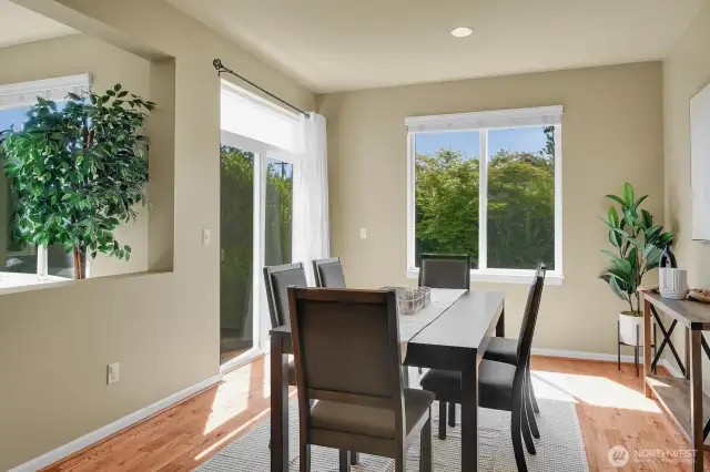 Dining room with access to the patio. So much natural light with all the huge windows!