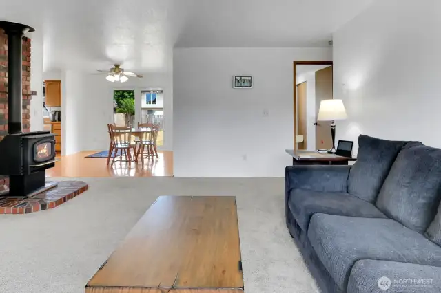 View from the living room into the dining area and kitchen.