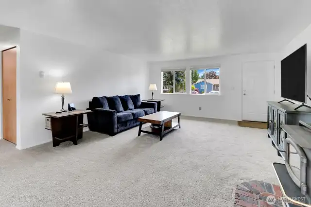 Freshly painted and new carpet greet you as you enter the home!