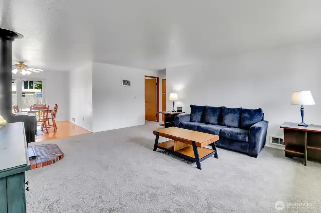 View of the living space looking towards the dining room and bedroom.