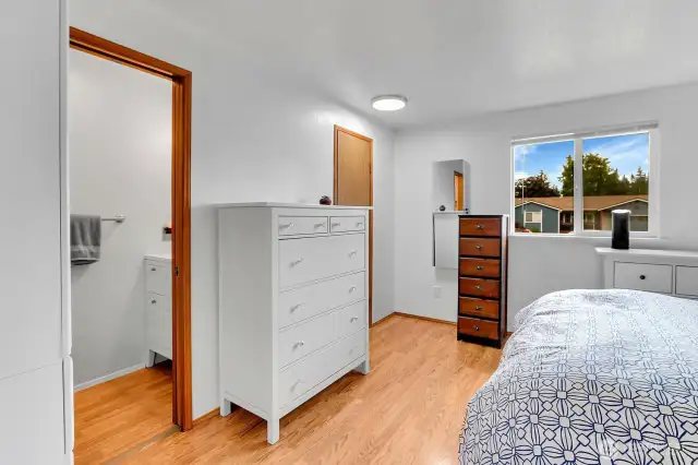 Primary bedroom with updated half bath and walk in closet.