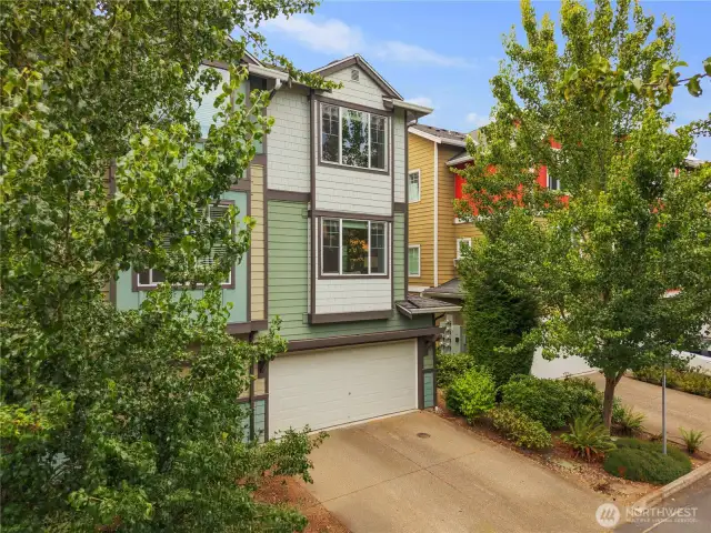 Back of the townhome with garage/driveway