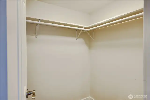 Primary bedroom walk in closet