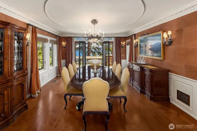 The dining room is set for formal dining and dinner parties.
