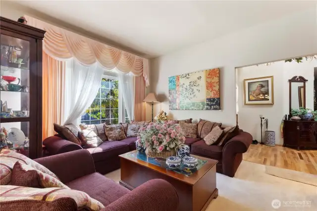 Large picture windows floods the formal living area with light