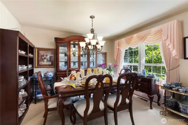 Formal Dining Area - large windows.  Connects to kitchen and formal living spaces