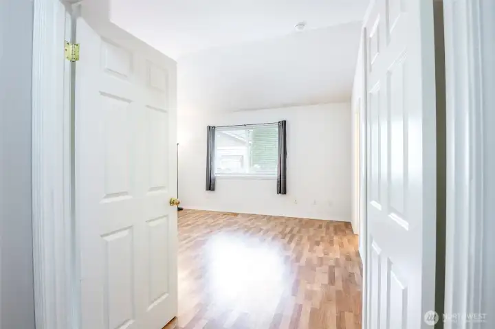 Welcome to the primary room! Love the french door entry!
