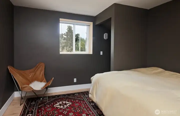 Lower Level Guest Room. There is a closet that follows the stairwell with extra storage space.