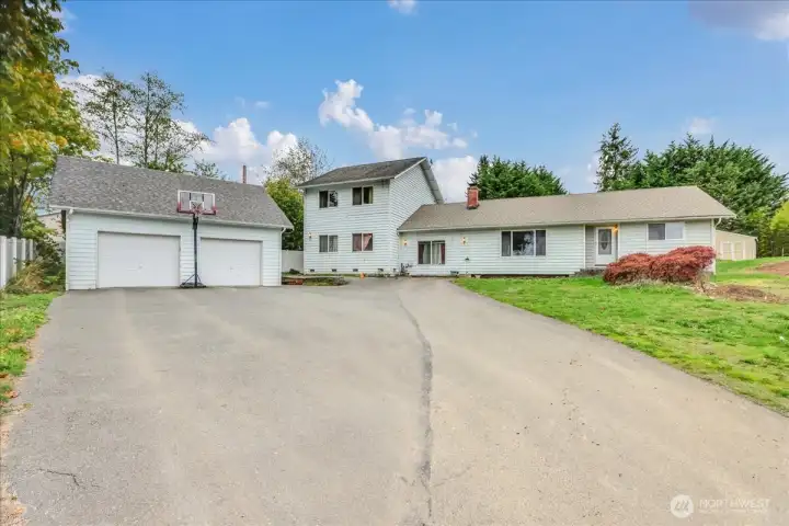 3+ bedroom, 2.5 bath home with detached oversized 2-car garage.  Would make a great rental/cash flow until ready to develop.