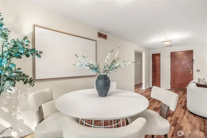 Dining room looking towards front door, with living room on the right. If you have a crowd, you can extend the table into the living room so there's space for everyone.