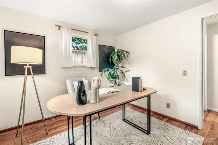 Back bedroom downstairs with windows on 2 walls. Perfect for an office.
