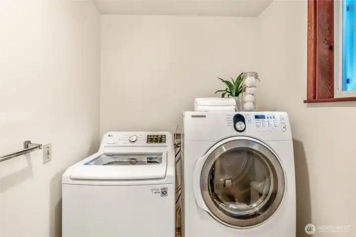 Washer/Dryer in the half bath/utility room on the ground floor just off the back entrance.