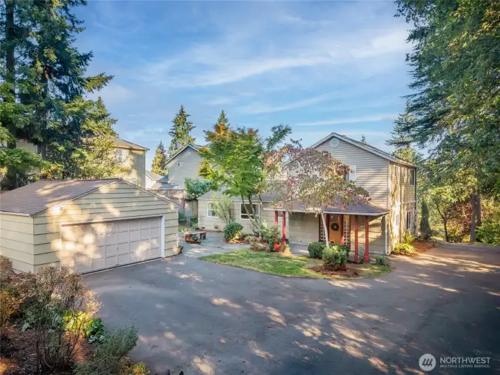 Detached garage and covered entry to home.