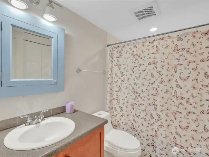 Full bathroom off hallway, also offering many upgrades!