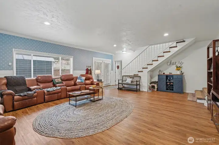 Family Room with Access to Patio and Stairway to 2nd Floor.