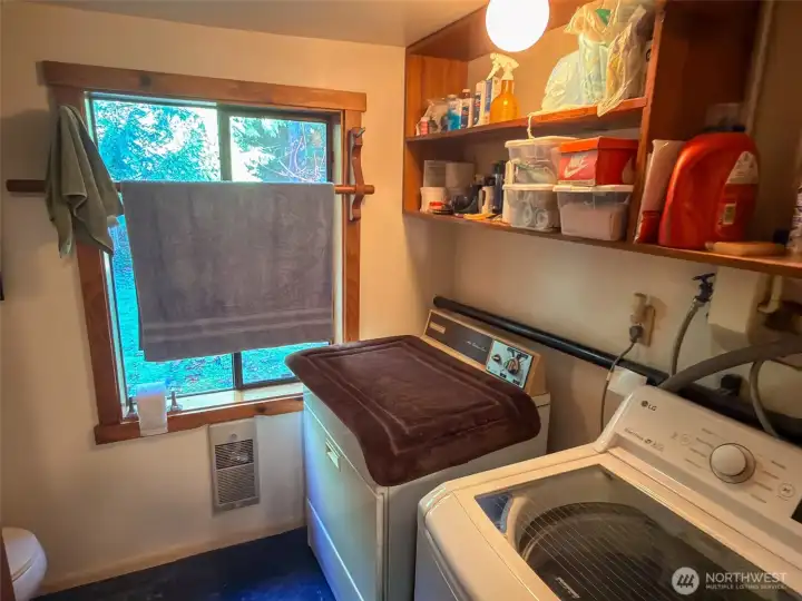 Laundry room and 3/4 bath combined with 1500 watt electric wall heater.