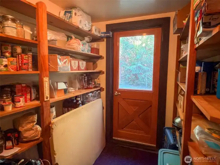 Walk-in pantry also includes a handy door to the natural beauty outside.
