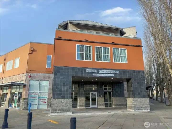 Contemporary mixed-use condominium building in the heart of downtown Renton, offering urban convenience and modern design.