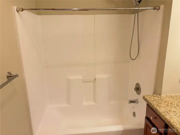 Full tub and shower combination designed for comfort and easy maintenance.