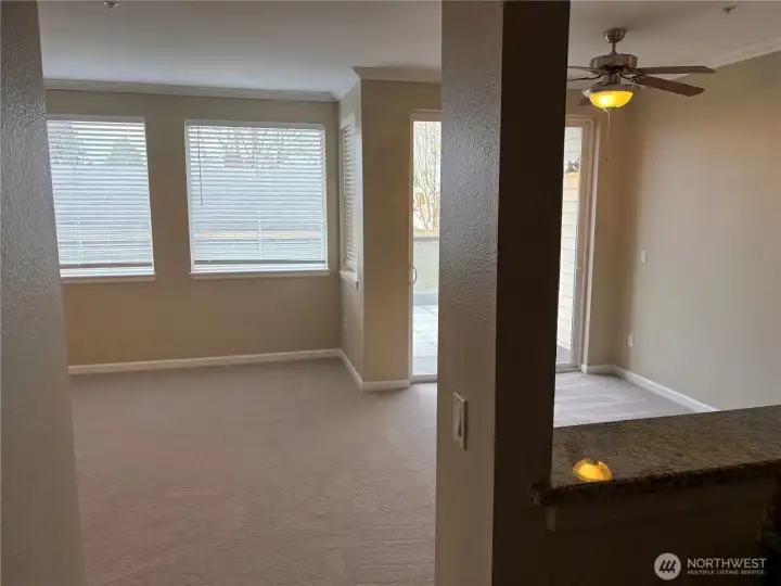 . View from kitchen toward living space, reinforcing the open-concept design.
