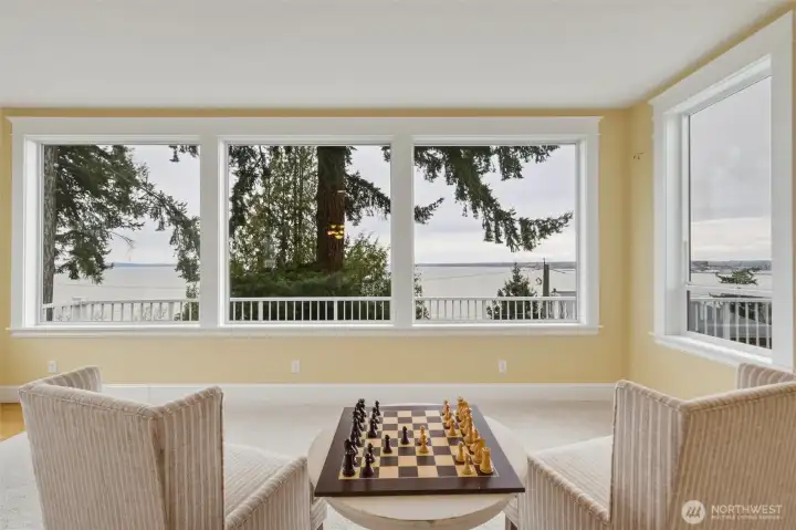 Sunken sitting room with new carpet and large windows framing beautiful Bellingham Bay views.