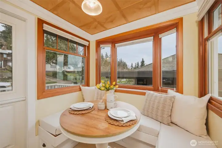 Charming breakfast nook with built-in seating and direct access to the view deck with gas hookup for BBQ.