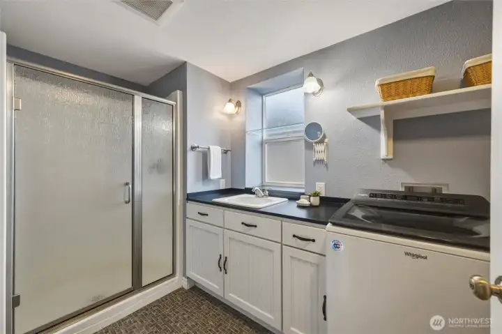 Lower-level ¾ bath with integrated laundry for added convenience