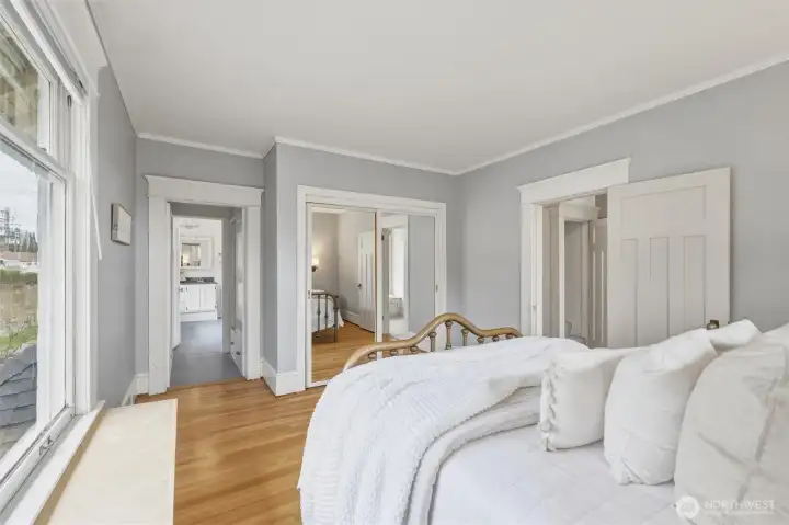 Second-floor bedroom with hardwood floors and convenient access to the adjoining bath