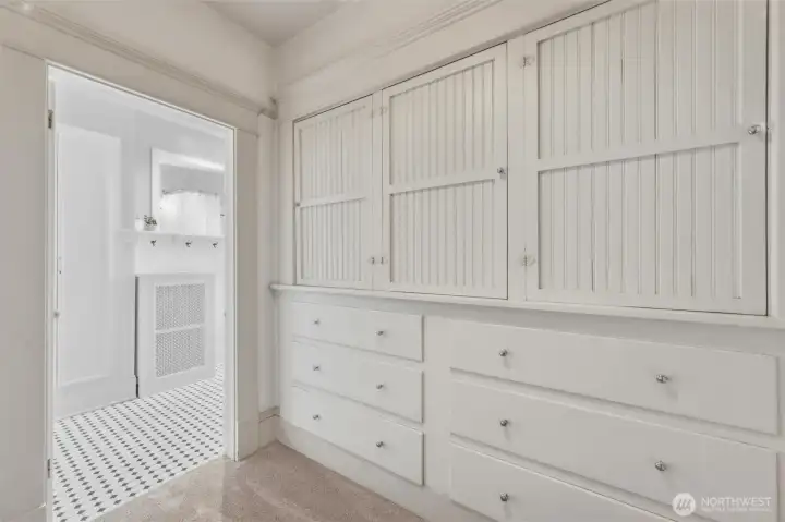 Second-level built-in cabinetry and drawers providing abundant storage and classic character.