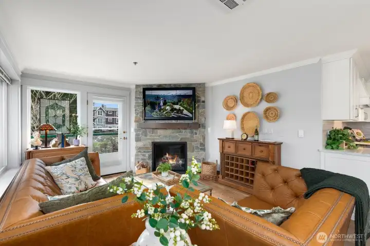 Living room has open layout and new TV hookups above the fireplace.  Crown moulding and new paint!