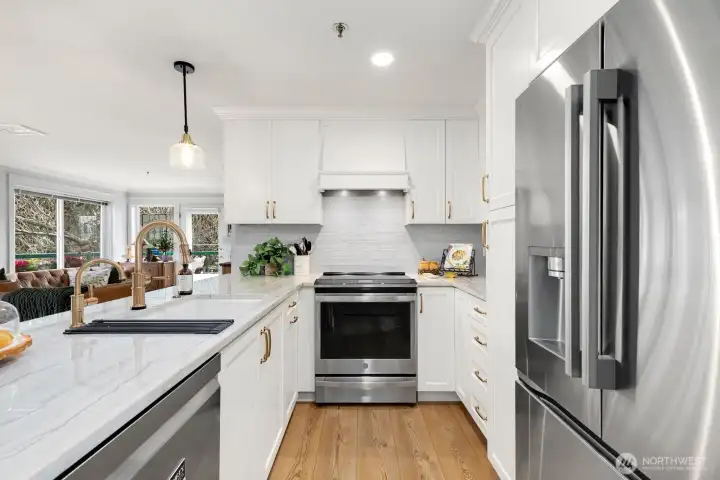 Seeded glass pendant lamps and under-counter lighting illuminate your work space.  Instant hot water at the sink.